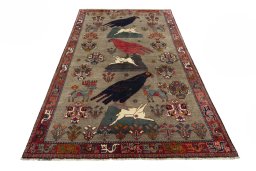 Surface texture of 2000s Persian Gabbeh rug with natural Wool and intricate pattern
