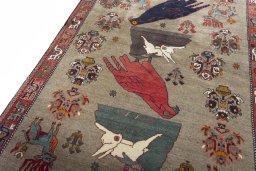 Backside of handmade 2000s Persian Gabbeh rug showing knot structure and weave density