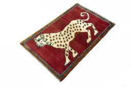 Corner detail of 2000s Persian Gabbeh rug showing border pattern and Wool pile