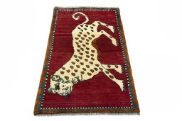 Surface texture of 2000s Persian Gabbeh rug with natural Wool and intricate pattern