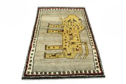 Surface texture of 2000s Persian Gabbeh rug with natural Wool and intricate pattern
