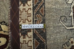 Corner detail of 2000s Persian Gabbeh rug showing border pattern and Wool pile