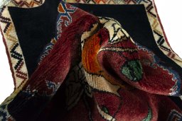 Corner detail of 2000s Persian Gabbeh rug showing border pattern and Wool pile