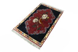 Corner detail of 2000s Persian Gabbeh rug showing border pattern and Wool pile