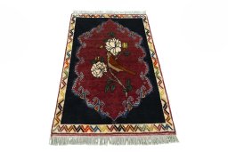 Surface texture of 2000s Persian Gabbeh rug with natural Wool and intricate pattern
