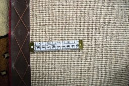 Corner detail of 2000s Persian Gabbeh rug showing border pattern and Wool pile