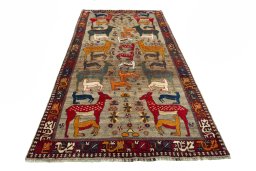 Surface texture of 2000s Persian Gabbeh rug with natural Wool and intricate pattern
