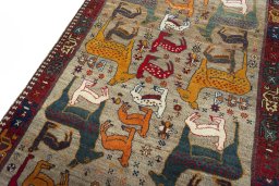 Backside of handmade 2000s Persian Gabbeh rug showing knot structure and weave density