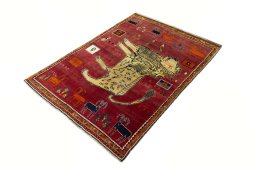 Corner detail of 2000s Persian Gabbeh rug showing border pattern and Wool pile