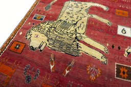 Backside of handmade 2000s Persian Gabbeh rug showing knot structure and weave density