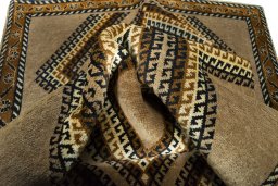 Corner detail of 2000s Persian Gabbeh rug showing border pattern and Wool pile