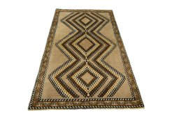 Surface texture of 2000s Persian Gabbeh rug with natural Wool and intricate pattern