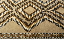 Close-up detail of 2000s Persian Gabbeh rug from Iran / Persia showing Wool weave