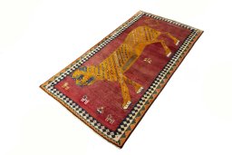 Corner detail of 2000s Persian Gabbeh rug showing border pattern and Wool pile