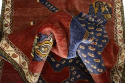 Corner detail of 2000s Persian Gabbeh rug showing border pattern and Wool pile