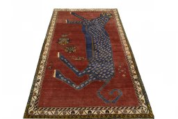 Surface texture of 2000s Persian Gabbeh rug with natural Wool and intricate pattern