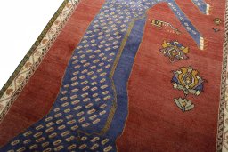 Backside of handmade 2000s Persian Gabbeh rug showing knot structure and weave density