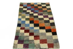 Surface texture of 2000s Persian Gabbeh rug with natural Wool and intricate pattern