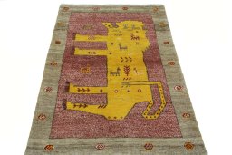 Surface texture of 2000s Persian Gabbeh rug with natural Wool and intricate pattern