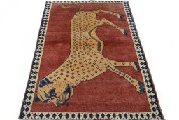 Surface texture of 2000s Persian Gabbeh rug with natural Wool and intricate pattern
