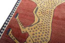 Backside of handmade 2000s Persian Gabbeh rug showing knot structure and weave density