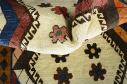 Corner detail of 2000s Persian Gabbeh rug showing border pattern and Wool pile