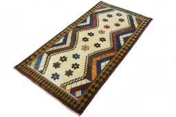 Corner detail of 2000s Persian Gabbeh rug showing border pattern and Wool pile