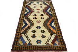 Surface texture of 2000s Persian Gabbeh rug with natural Wool and intricate pattern