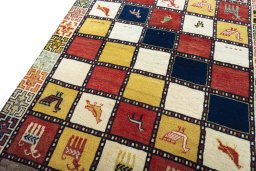 Backside of handmade 2000s Persian Gabbeh rug showing knot structure and weave density