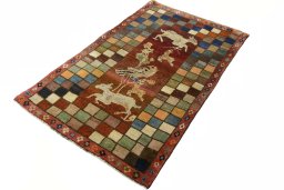 Corner detail of 2000s Persian Gabbeh rug showing border pattern and Wool pile