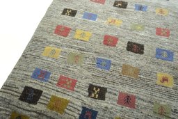 Backside of handmade New Persian Gabbeh rug showing knot structure and weave density