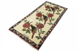 Corner detail of 2000s Persian Gabbeh rug showing border pattern and Wool pile