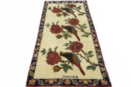 Surface texture of 2000s Persian Gabbeh rug with natural Wool and intricate pattern