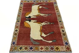 Surface texture of 2000s Persian Gabbeh rug with natural Wool and intricate pattern