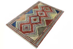 Corner detail of 2000s Persian Gabbeh rug showing border pattern and Wool pile