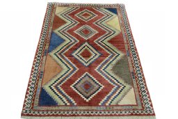 Surface texture of 2000s Persian Gabbeh rug with natural Wool and intricate pattern