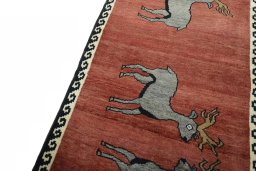 Backside of handmade 2000s Persian Gabbeh rug showing knot structure and weave density
