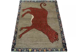 Surface texture of 2000s Persian Gabbeh rug with natural Wool and intricate pattern
