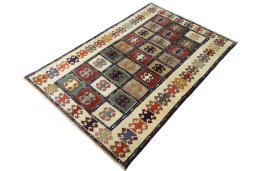 Corner detail of 2000s Persian Gabbeh rug showing border pattern and Wool pile