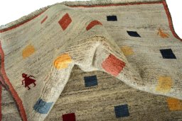 Corner detail of 2000s Persian Gabbeh rug showing border pattern and Wool pile
