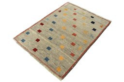 Corner detail of 2000s Persian Gabbeh rug showing border pattern and Wool pile