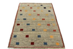 Surface texture of 2000s Persian Gabbeh rug with natural Wool and intricate pattern