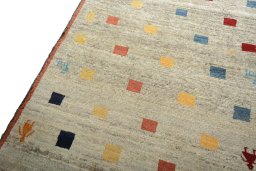 Backside of handmade 2000s Persian Gabbeh rug showing knot structure and weave density
