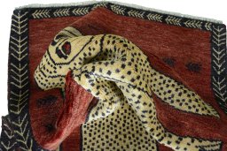 Corner detail of 2000s Persian Gabbeh rug showing border pattern and Wool pile