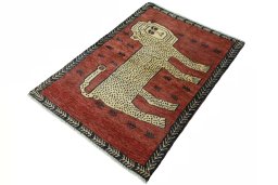 Corner detail of 2000s Persian Gabbeh rug showing border pattern and Wool pile