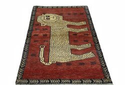 Surface texture of 2000s Persian Gabbeh rug with natural Wool and intricate pattern