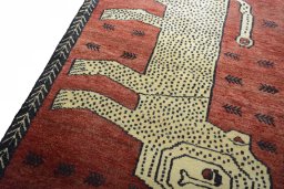 Backside of handmade 2000s Persian Gabbeh rug showing knot structure and weave density