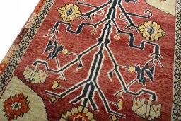 Backside of handmade 2000s Persian Gabbeh rug showing knot structure and weave density