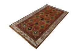Corner detail of 2000s Persian Gabbeh rug showing border pattern and Wool pile