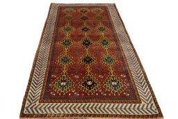 Surface texture of 2000s Persian Gabbeh rug with natural Wool and intricate pattern